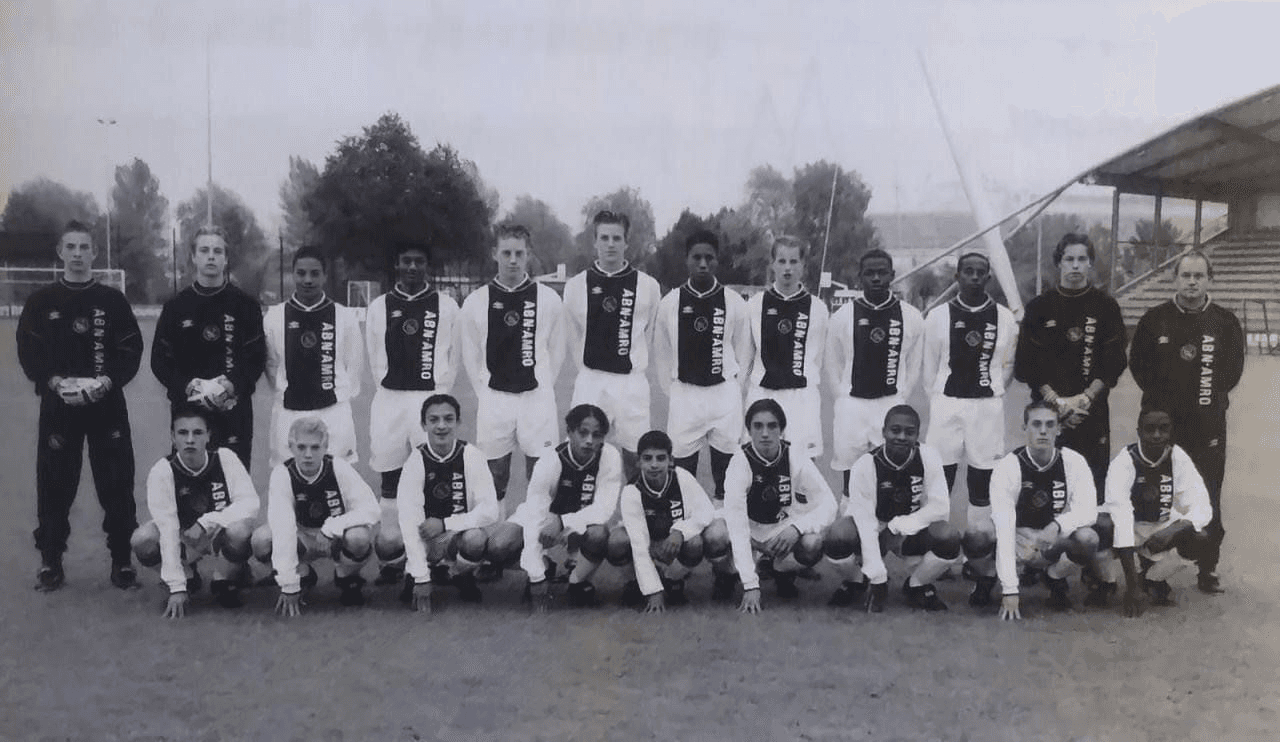 Ajax youth football team posing together on the pitch