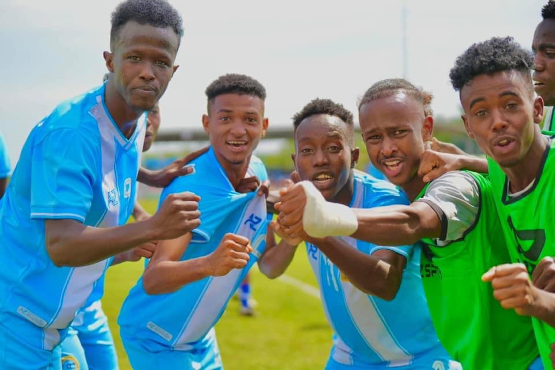 Somalia football players celebrating together